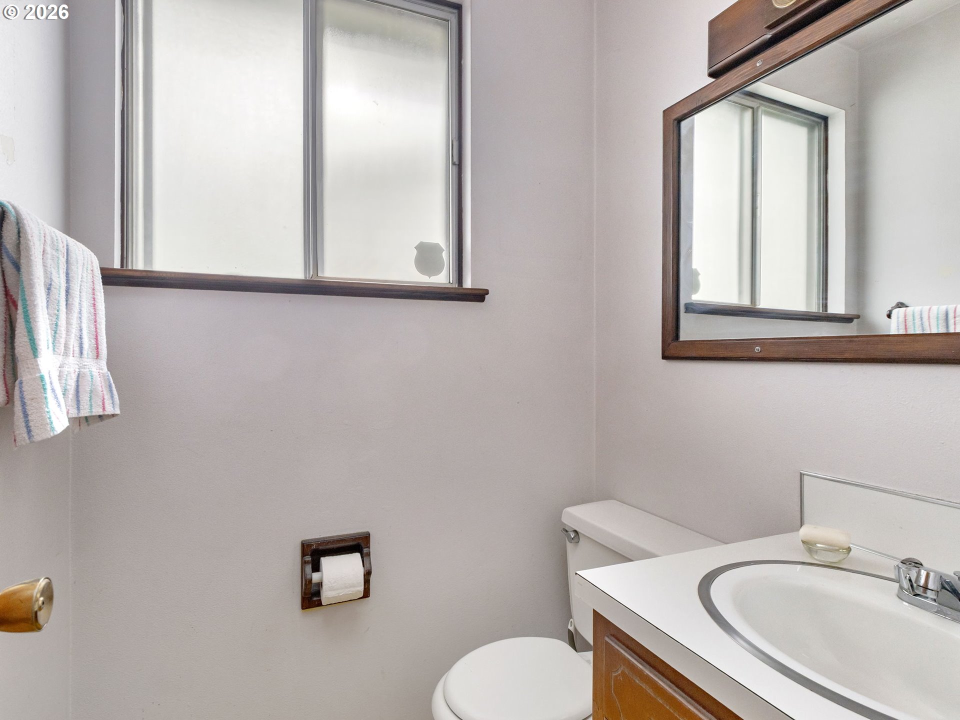 1033 Northeast 178th Avenue Portland, OR 97230 - Photo 23 of 29 a bathroom with a toilet sink and mirror
