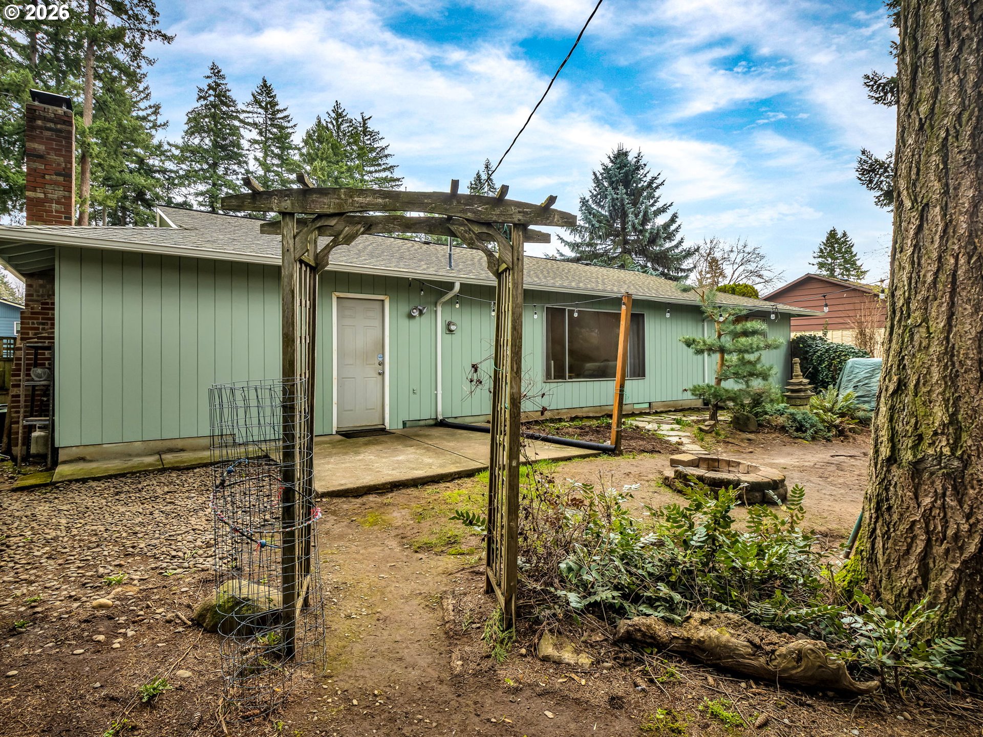 1033 Northeast 178th Avenue Portland, OR 97230 - Photo 29 of 29 a house with a tree in front of it