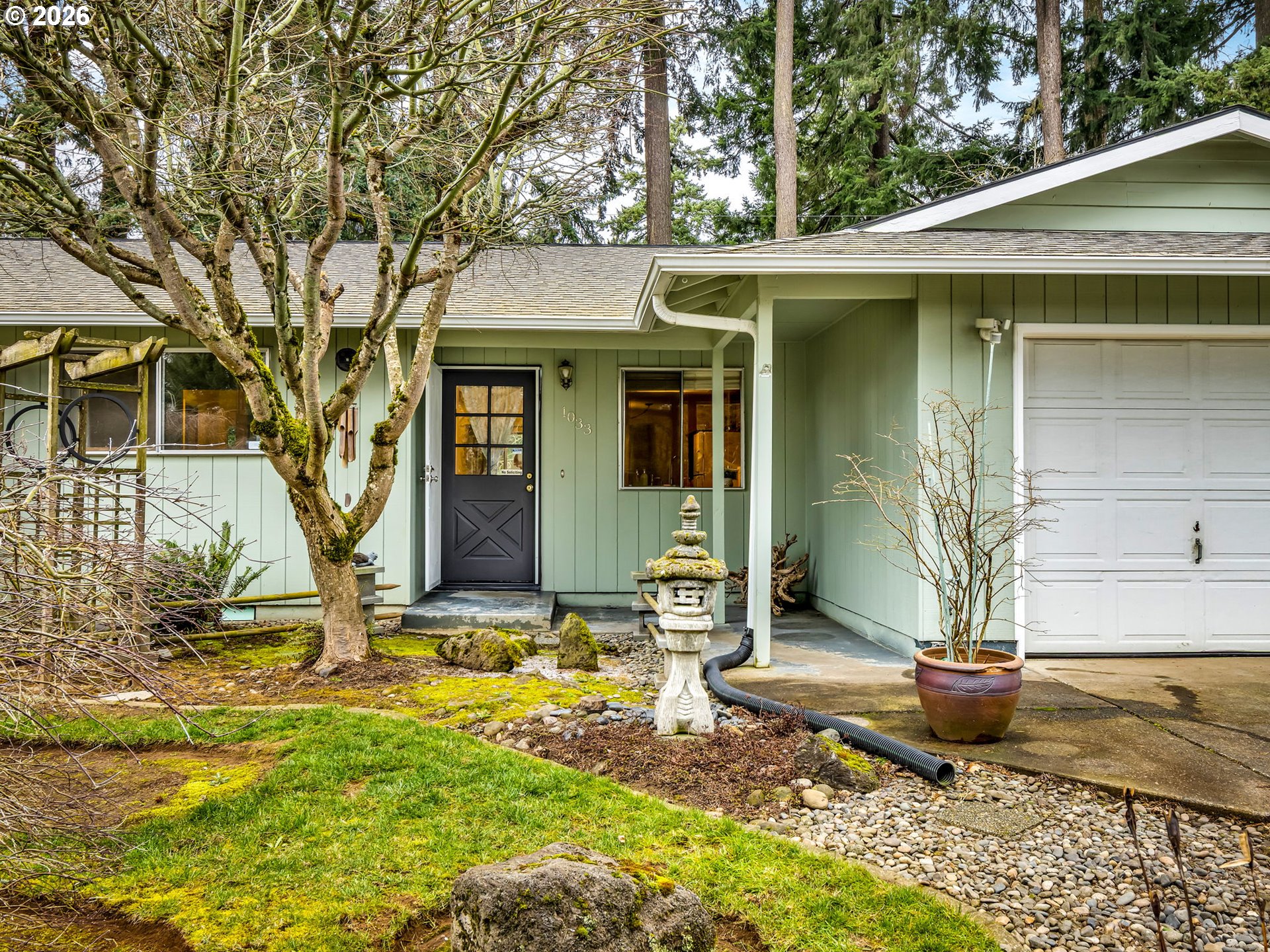 1033 Northeast 178th Avenue Portland, OR 97230 - Photo 3 of 29 a front view of a house with garden
