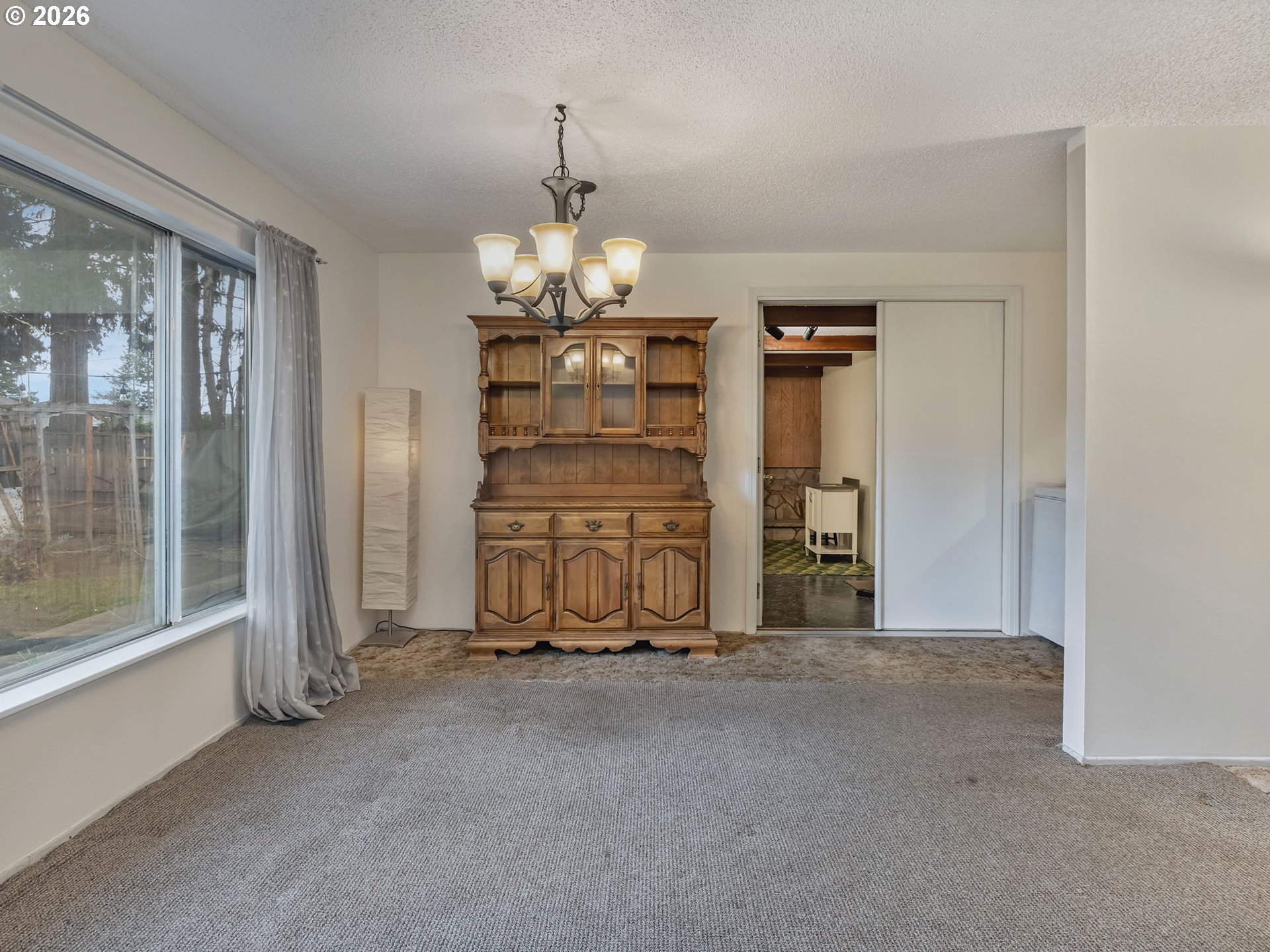 1033 Northeast 178th Avenue Portland, OR 97230 - Photo 9 of 29 a view of an empty room with a fireplace