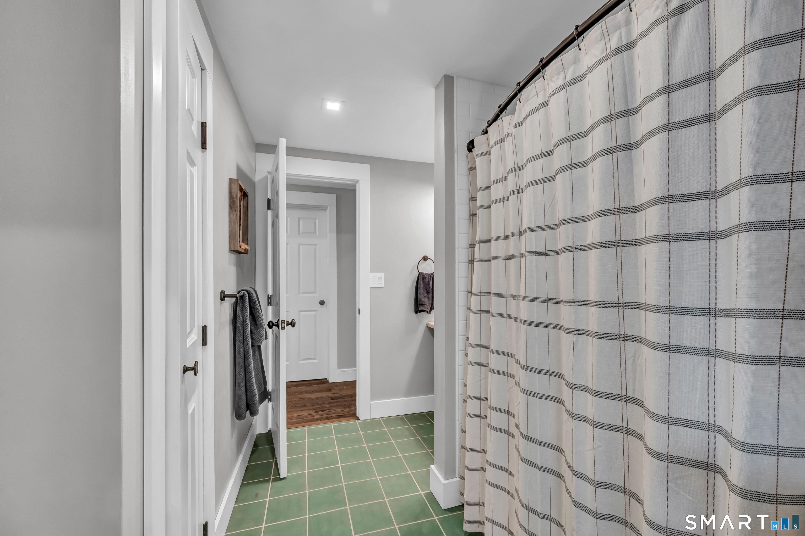 10 Grove Place Bethel, CT 06801 - Photo 18 of 33 a bathroom with a shower and a glass door