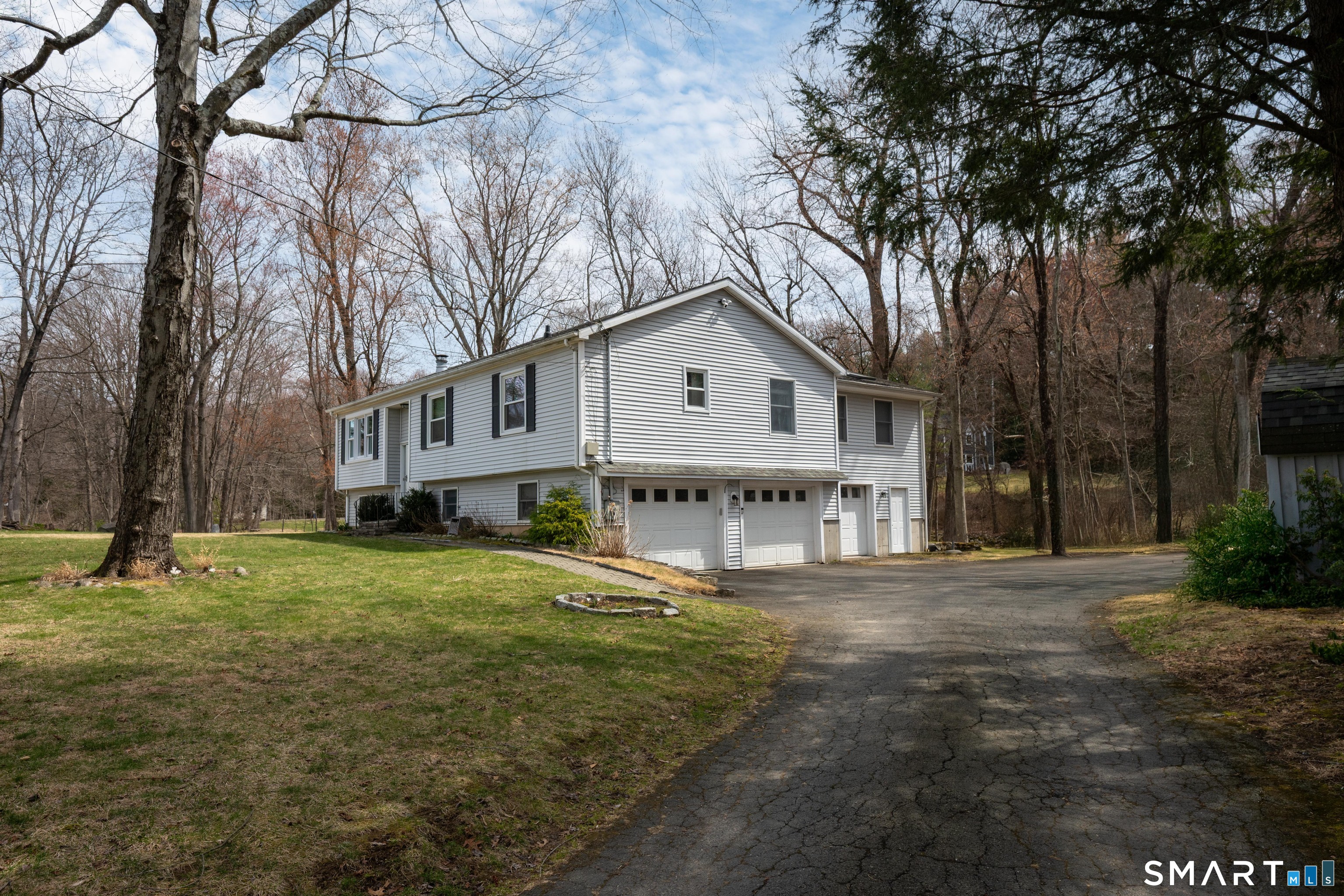10 Grove Place Bethel, CT 06801 - Photo 2 of 33 a front view of a house with a garden