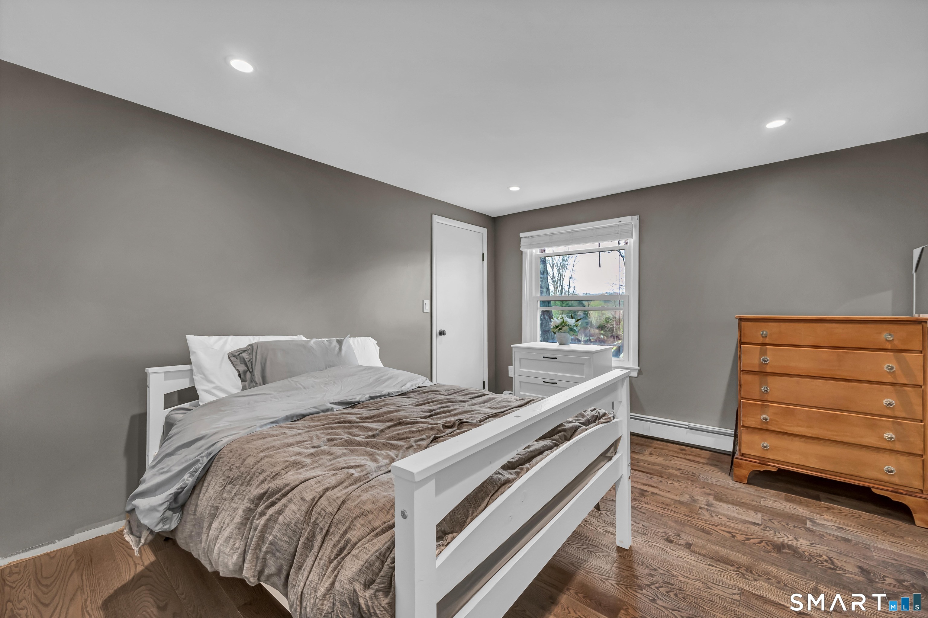 10 Grove Place Bethel, CT 06801 - Photo 21 of 33 a bedroom with a bed and a window