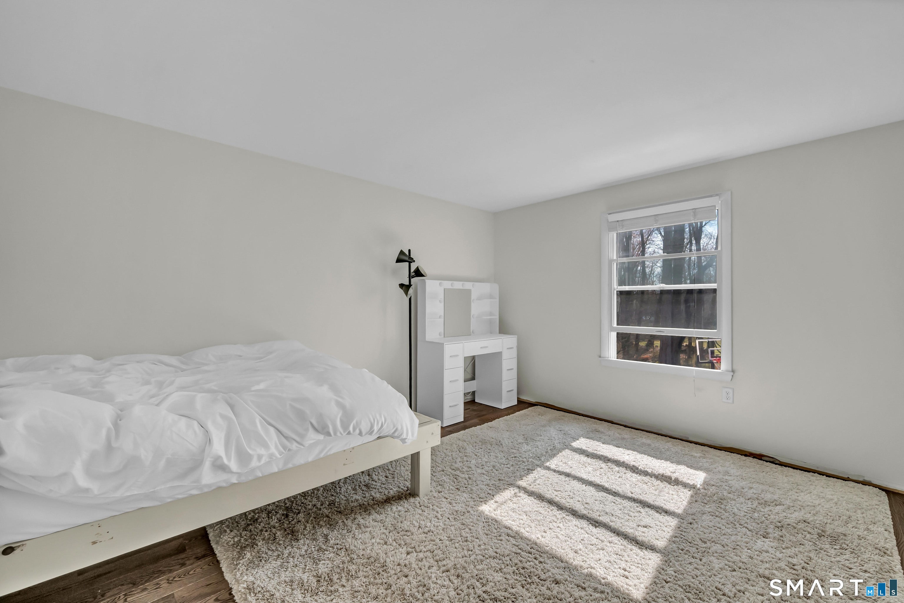 10 Grove Place Bethel, CT 06801 - Photo 22 of 33 a bedroom with a bed and a window