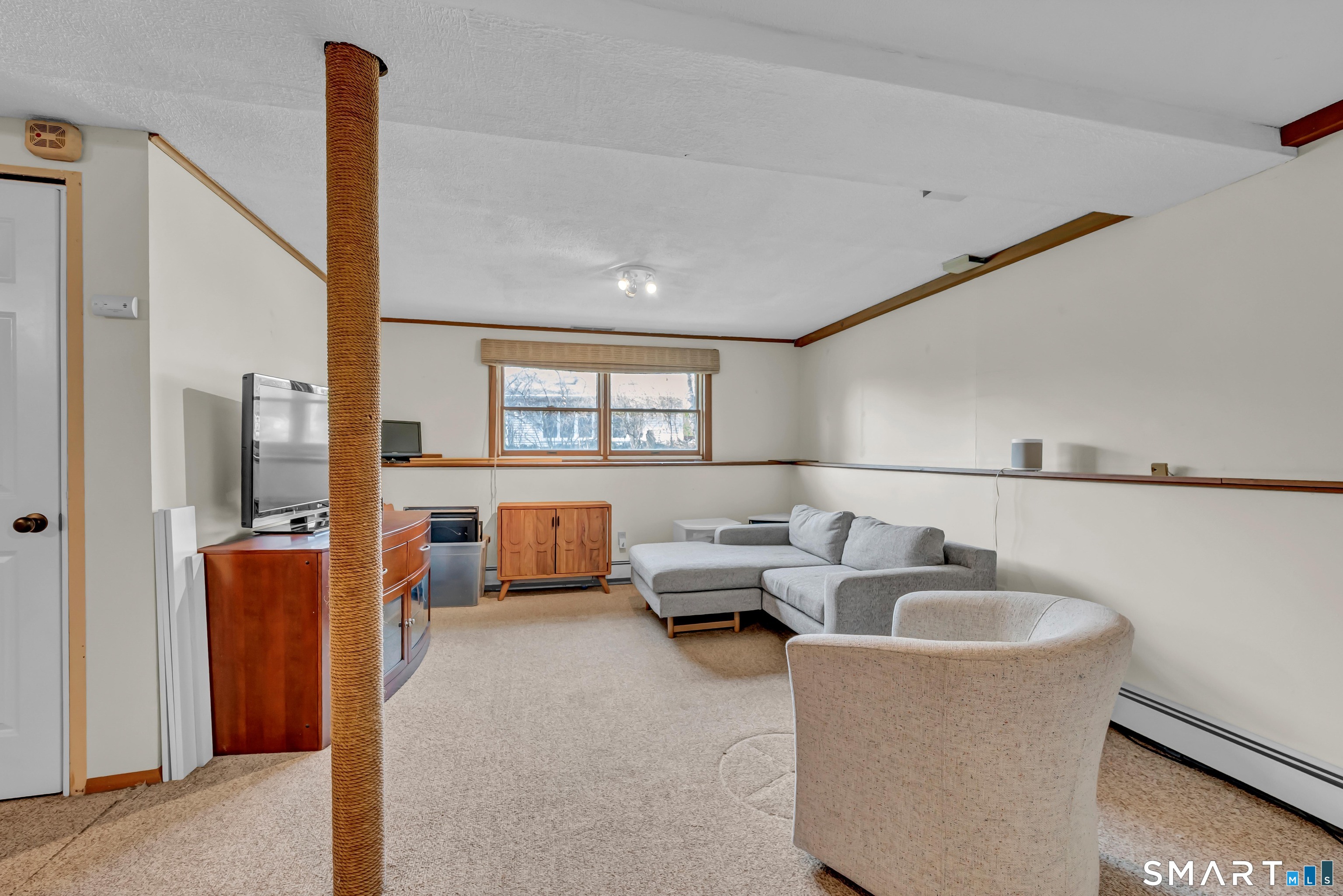 10 Grove Place Bethel, CT 06801 - Photo 28 of 33 a living room with furniture and a window