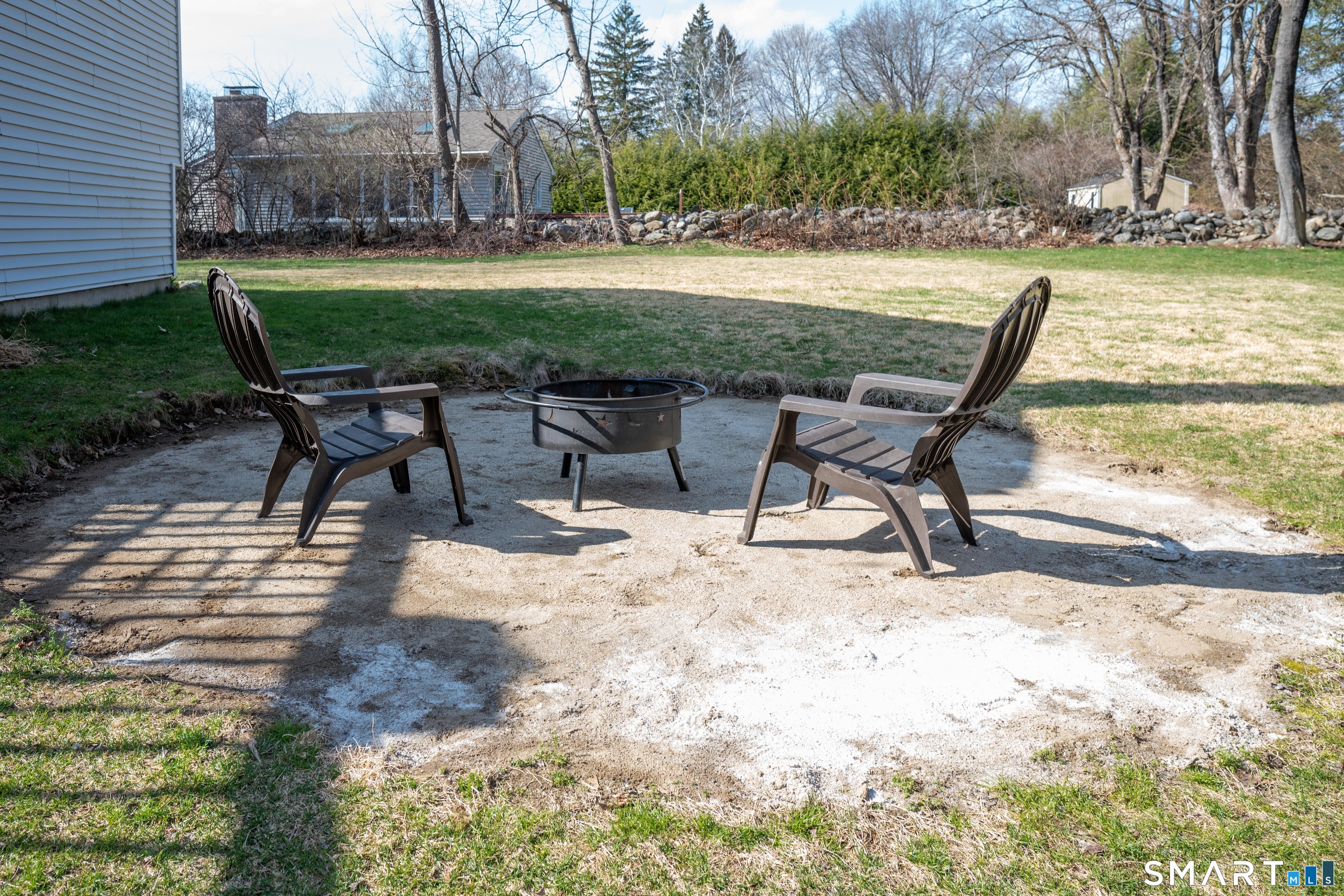10 Grove Place Bethel, CT 06801 - Photo 31 of 33 a view of a backyard with table and chairs potted plants and palm tree
