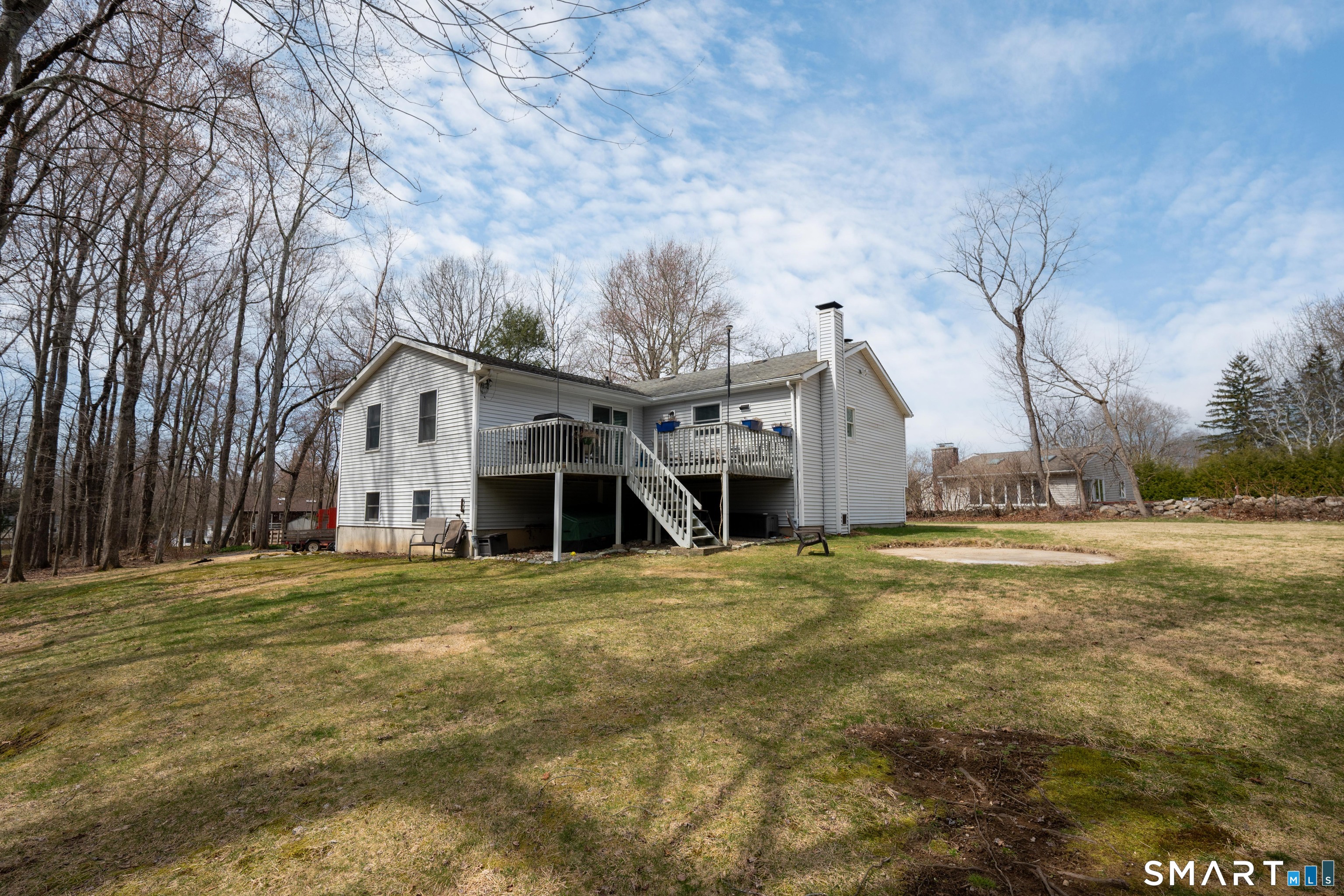 10 Grove Place Bethel, CT 06801 - Photo 33 of 33 a white house sitting in middle of a field