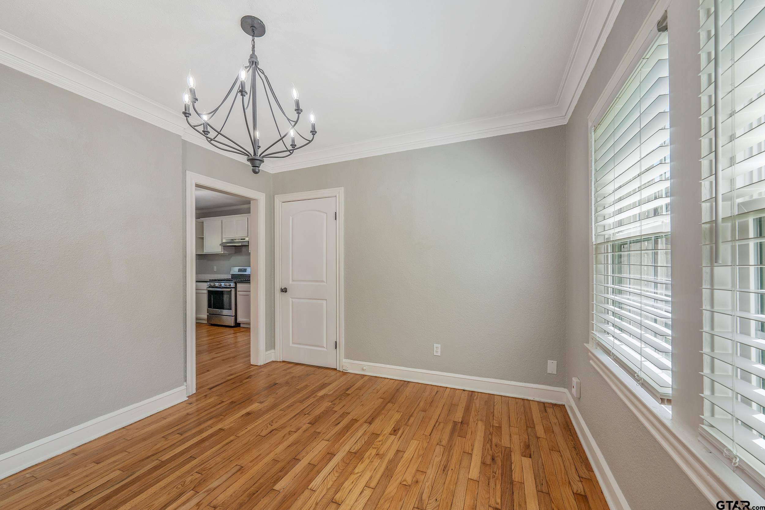 434 South Vine Avenue Tyler, TX 75702 - Photo 11 of 29 a view of a room with wooden floor and windows