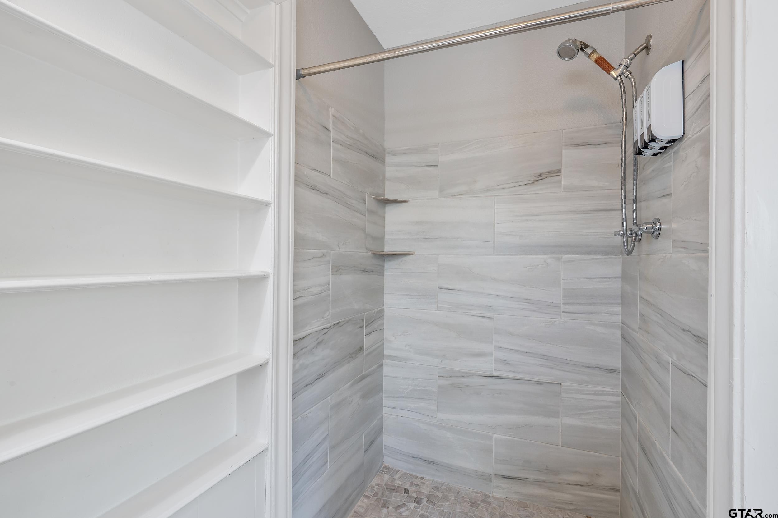 434 South Vine Avenue Tyler, TX 75702 - Photo 16 of 29 a bathroom with a shower