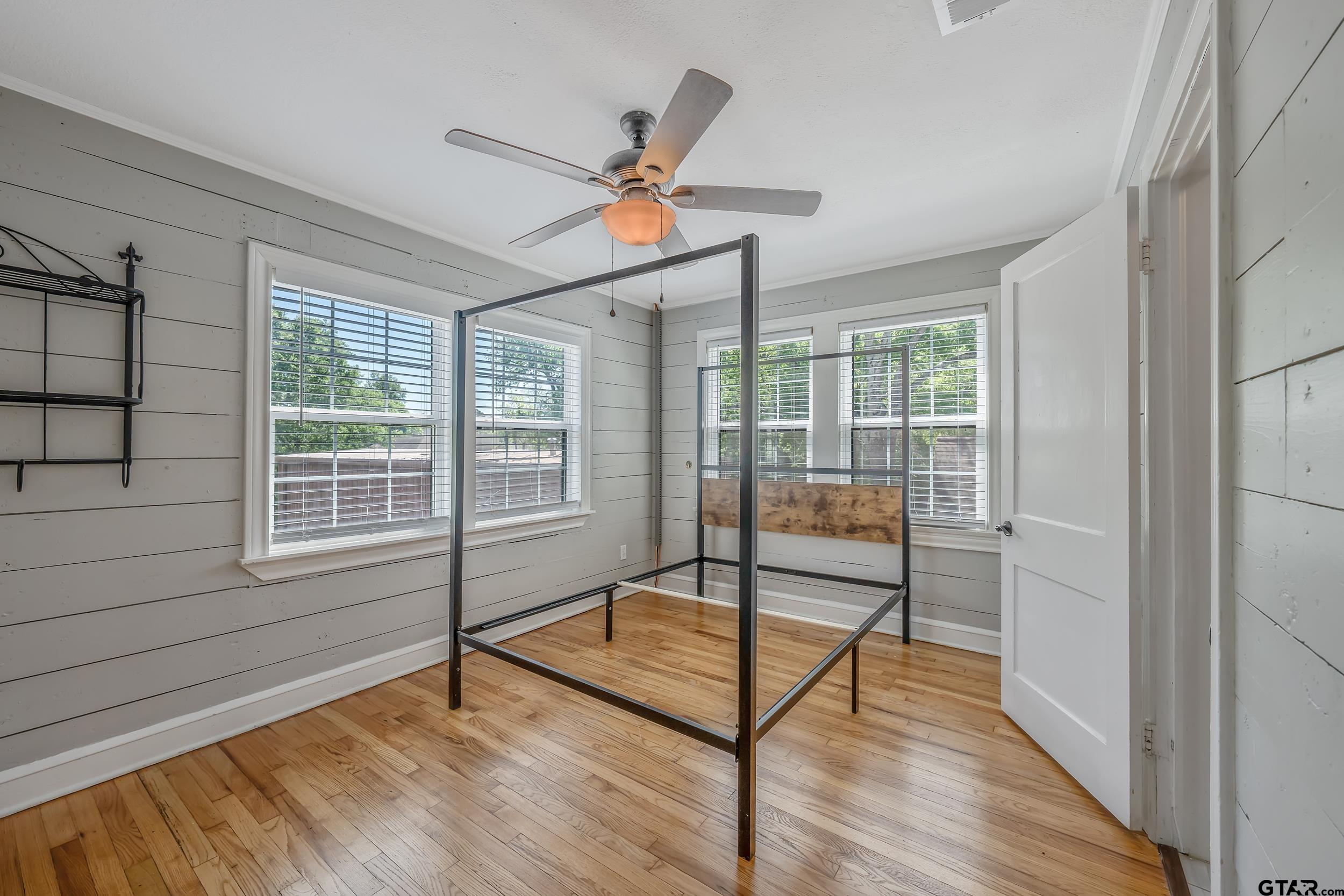 434 South Vine Avenue Tyler, TX 75702 - Photo 18 of 29 a view of a livingroom with furniture wooden floor and a window
