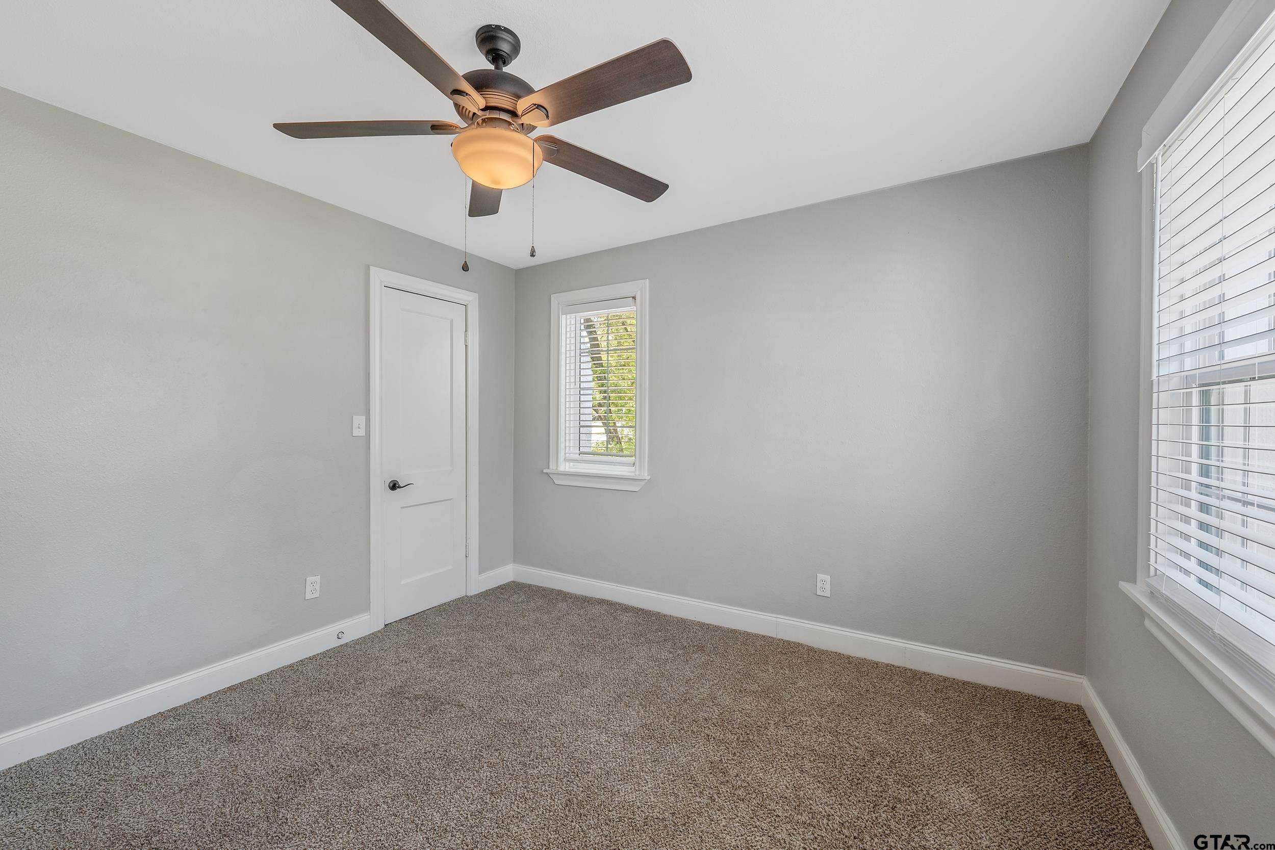 434 South Vine Avenue Tyler, TX 75702 - Photo 20 of 29 wooden floor in an empty room with a window