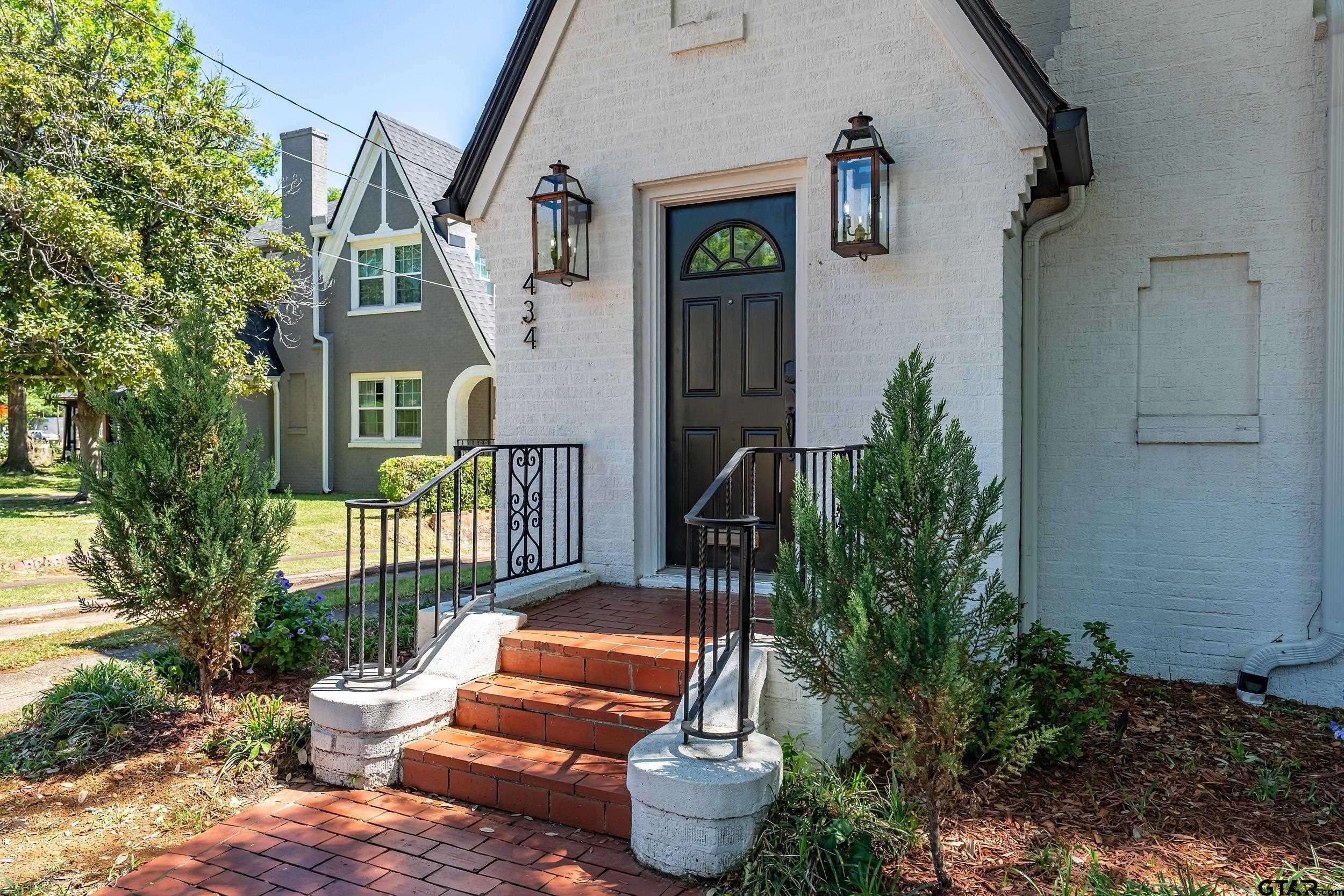434 South Vine Avenue Tyler, TX 75702 - Photo 2 of 29 a backyard of a house with outdoor seating