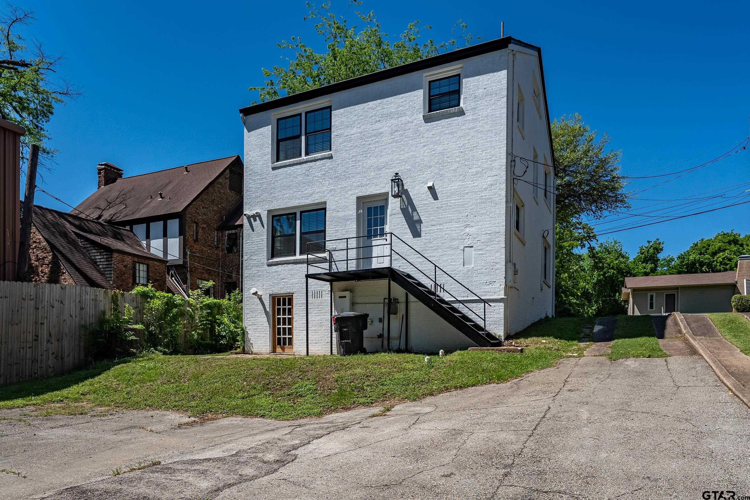 434 South Vine Avenue Tyler, TX 75702 - Photo 28 of 29 a front view of a house with a yard
