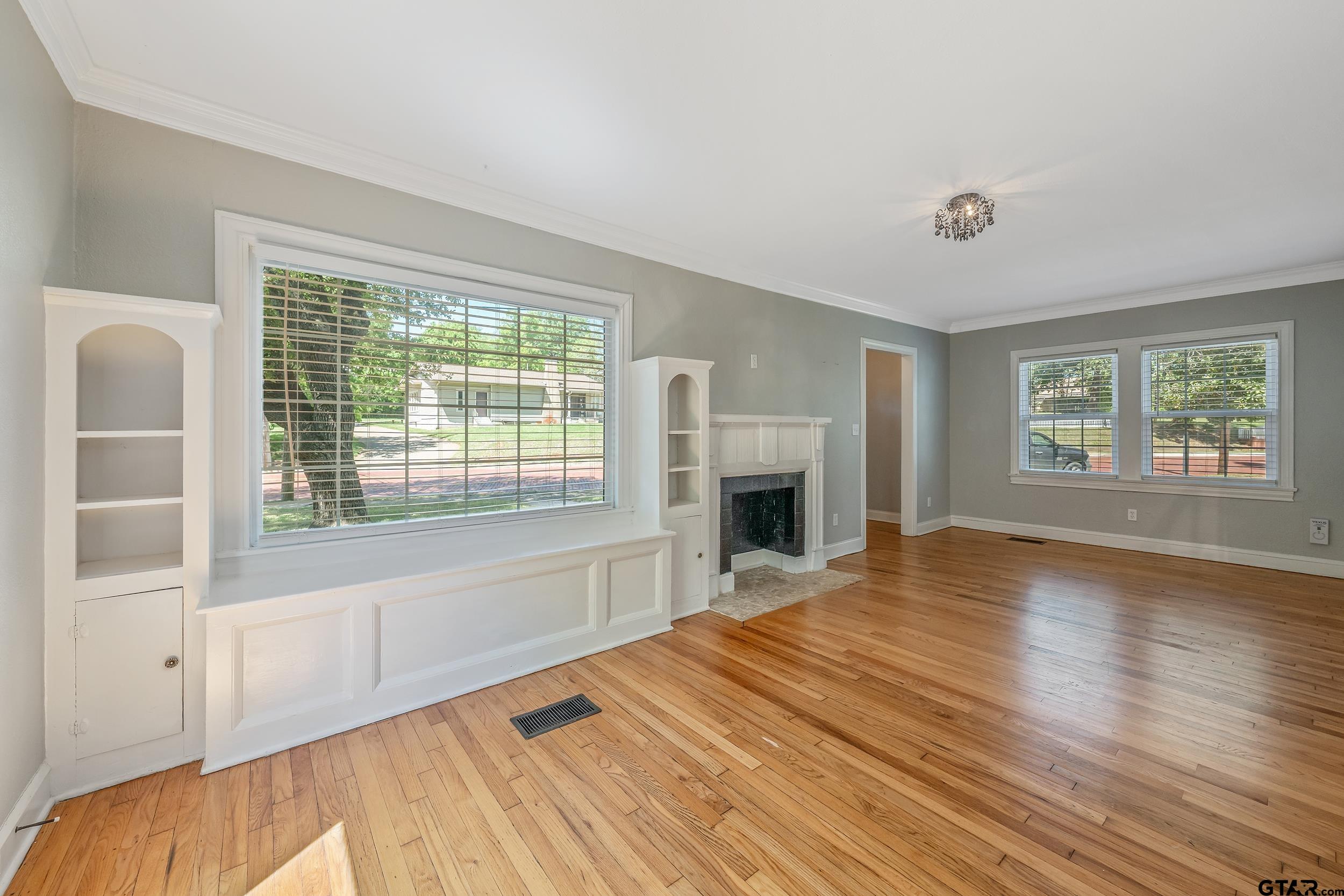 434 South Vine Avenue Tyler, TX 75702 - Photo 6 of 29 a spacious bedroom with a bed and a fireplace
