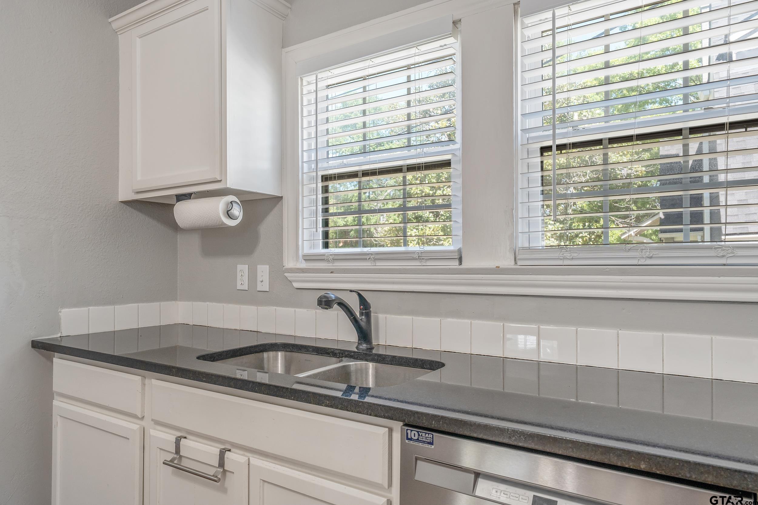434 South Vine Avenue Tyler, TX 75702 - Photo 10 of 29 a kitchen with a sink and cabinets