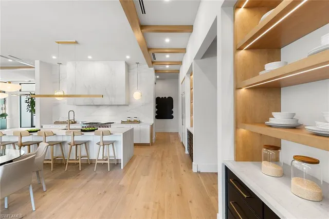 a kitchen with stainless steel appliances kitchen island granite countertop a sink and cabinets