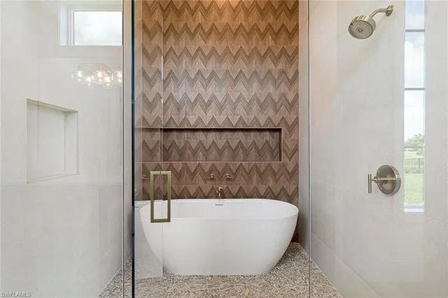 a dining room with furniture and a floor to ceiling window