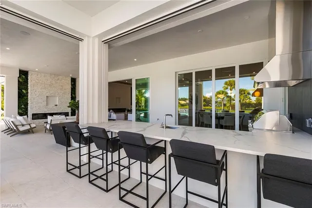 a view of a swimming pool and lounge chairs