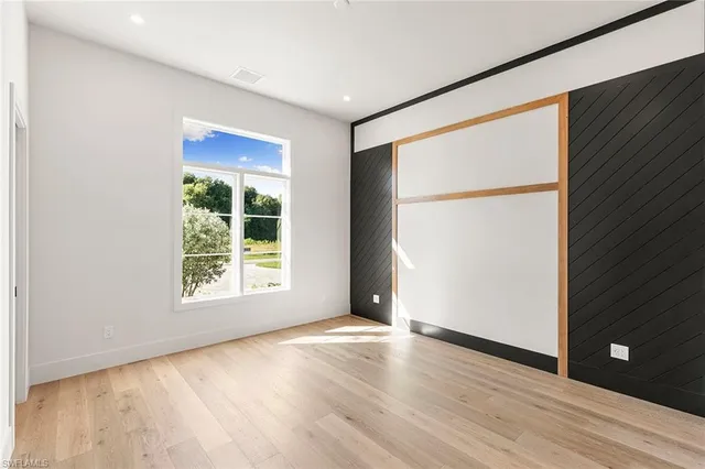 a bathroom with a sink shower and a mirror