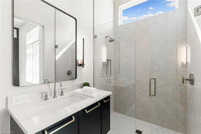 a utility room with sink dryer and washer