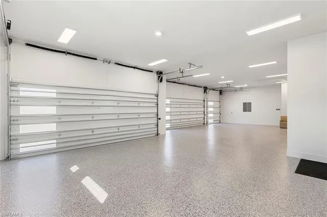 an aerial view of a house with a garden and trees