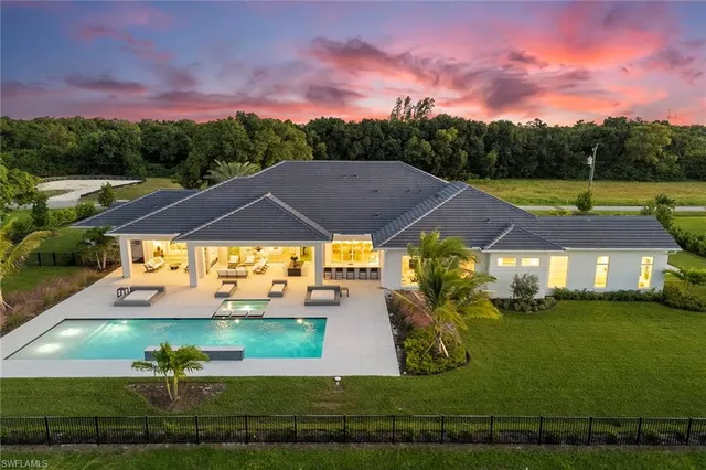 a view of a swimming pool and lounge chair