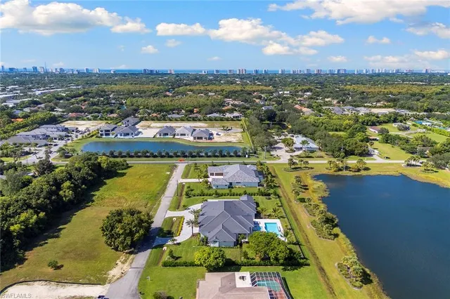 an aerial view of a city with lake view