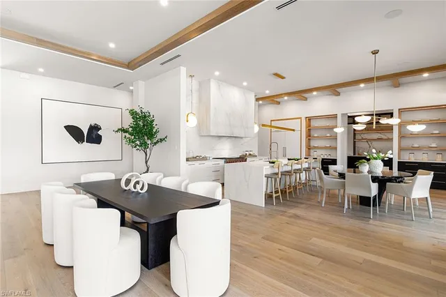 a kitchen with a table and chairs