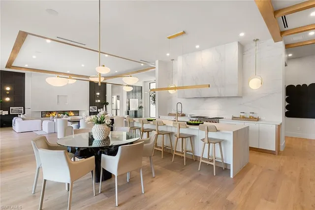 a large kitchen with a table and chairs