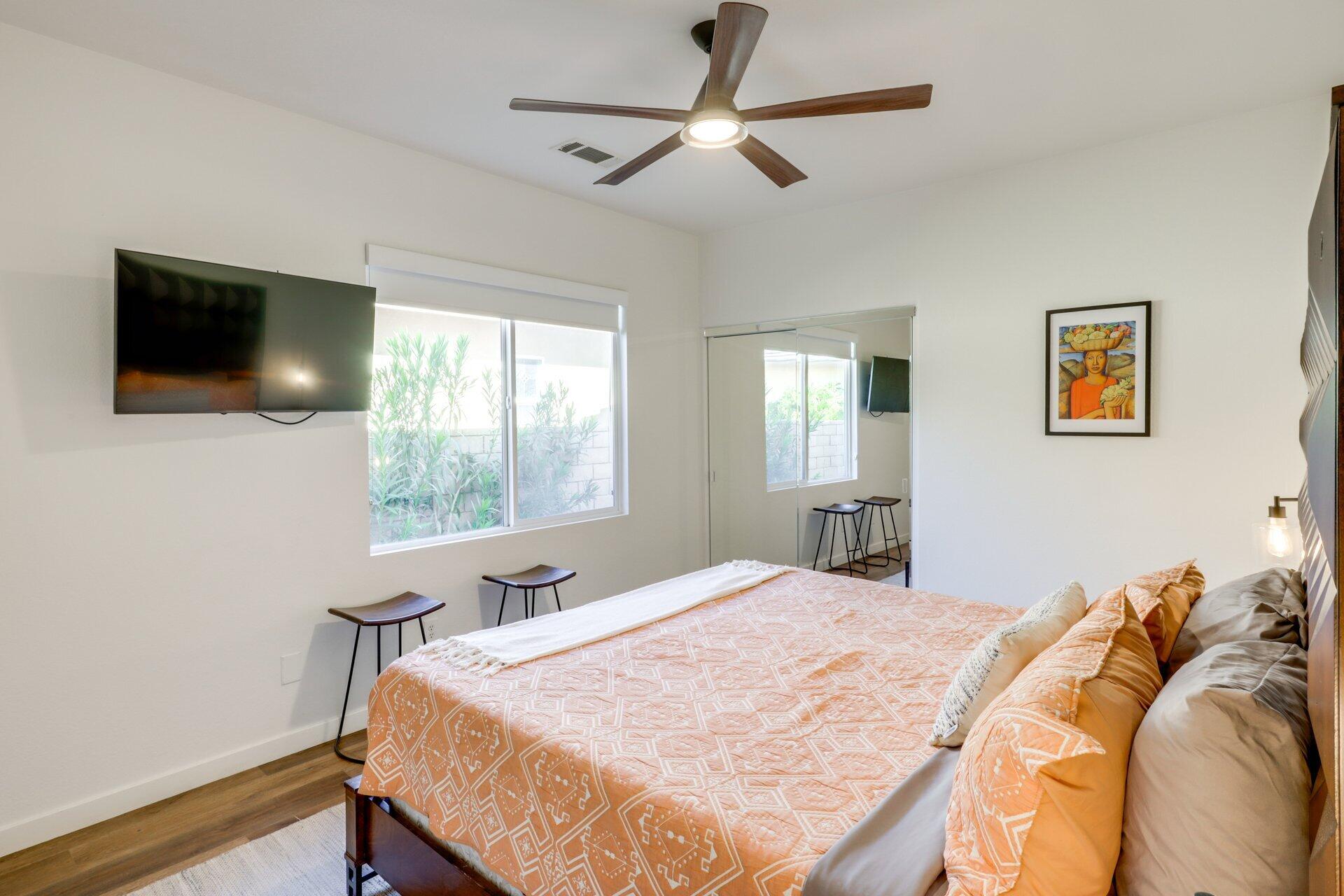 84644 Pavone Way Indio, CA 92203 - Photo 23 of 46 a bed sitting in a bedroom and a flat screen tv