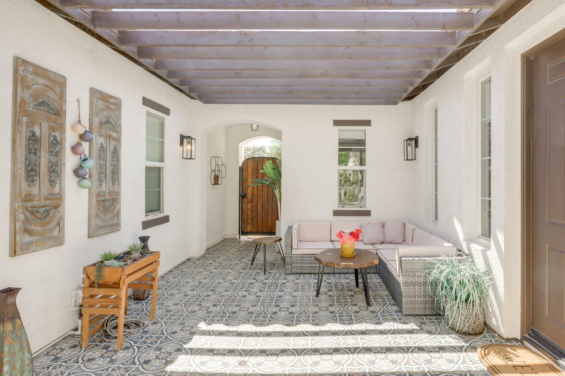 84644 Pavone Way Indio, CA 92203 - Photo 3 of 46 a living room with furniture and a potted plant