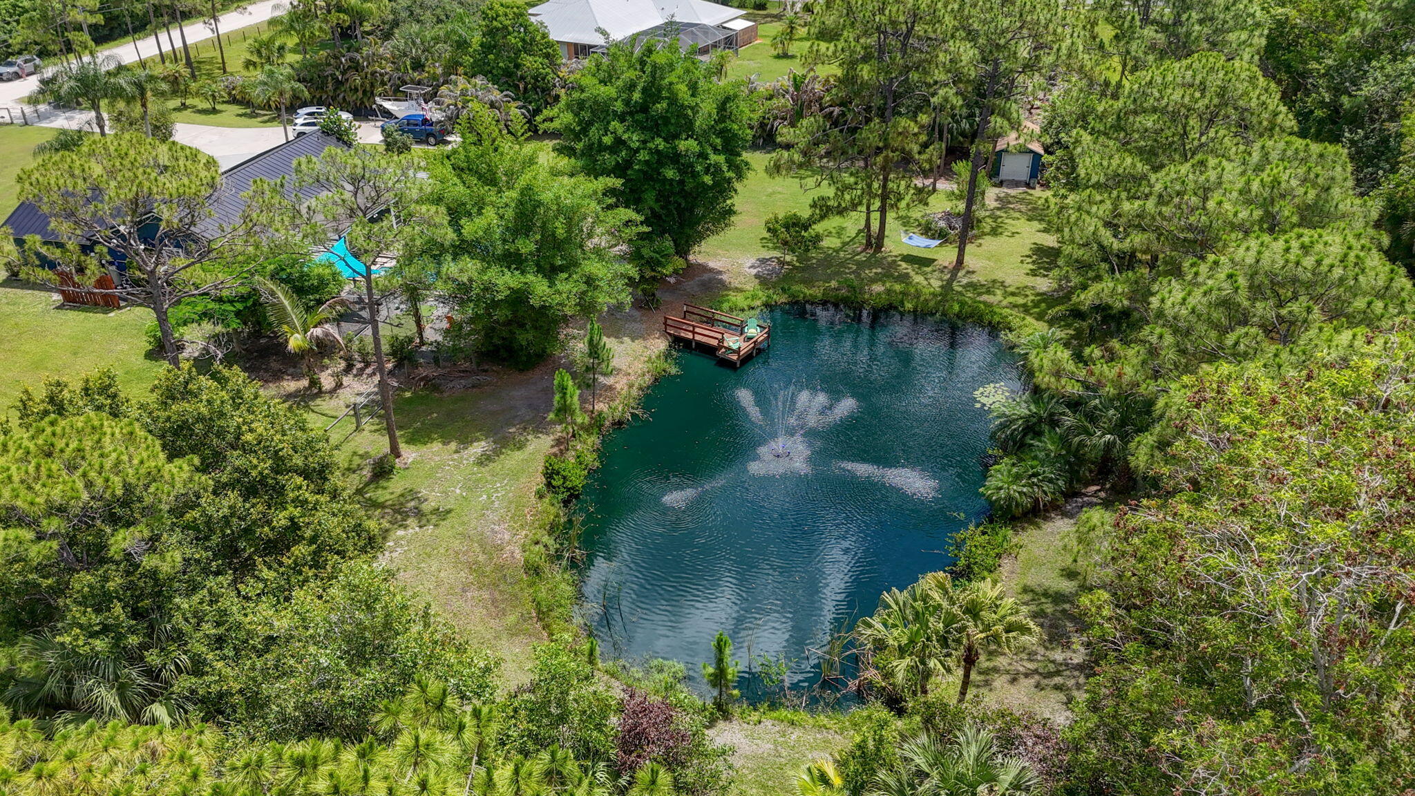 12558 165th Road North Jupiter, FL 33478 - Photo 55 of 67 an aerial view of a house with a yard