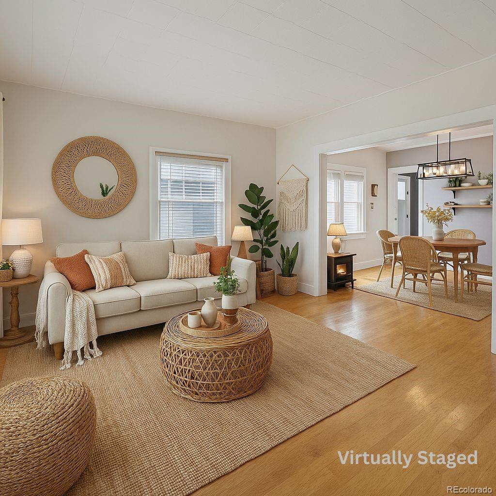 405 Maple Street Fort Morgan, CO 80701 - Photo 2 of 9 a living room with furniture and a large window