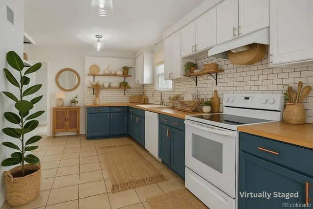 a kitchen with stainless steel appliances granite countertop a sink a stove and cabinets