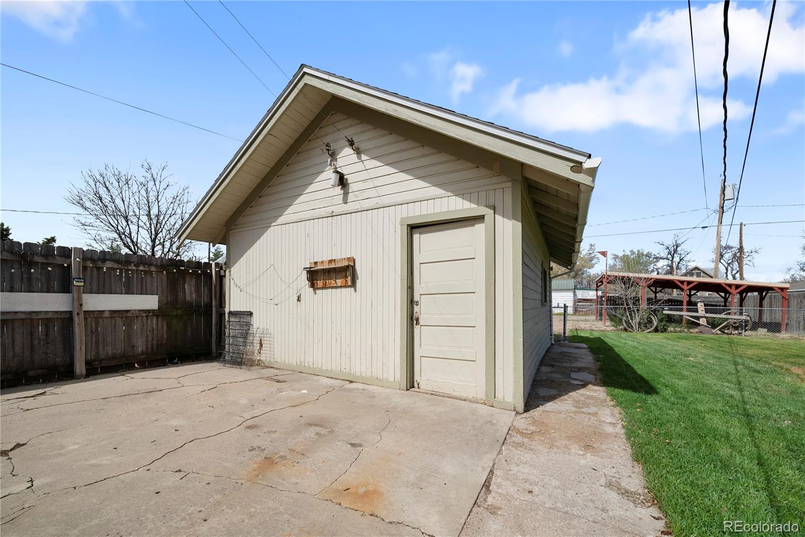 405 Maple Street Fort Morgan, CO 80701 - Photo 7 of 9 a view of a house with a yard