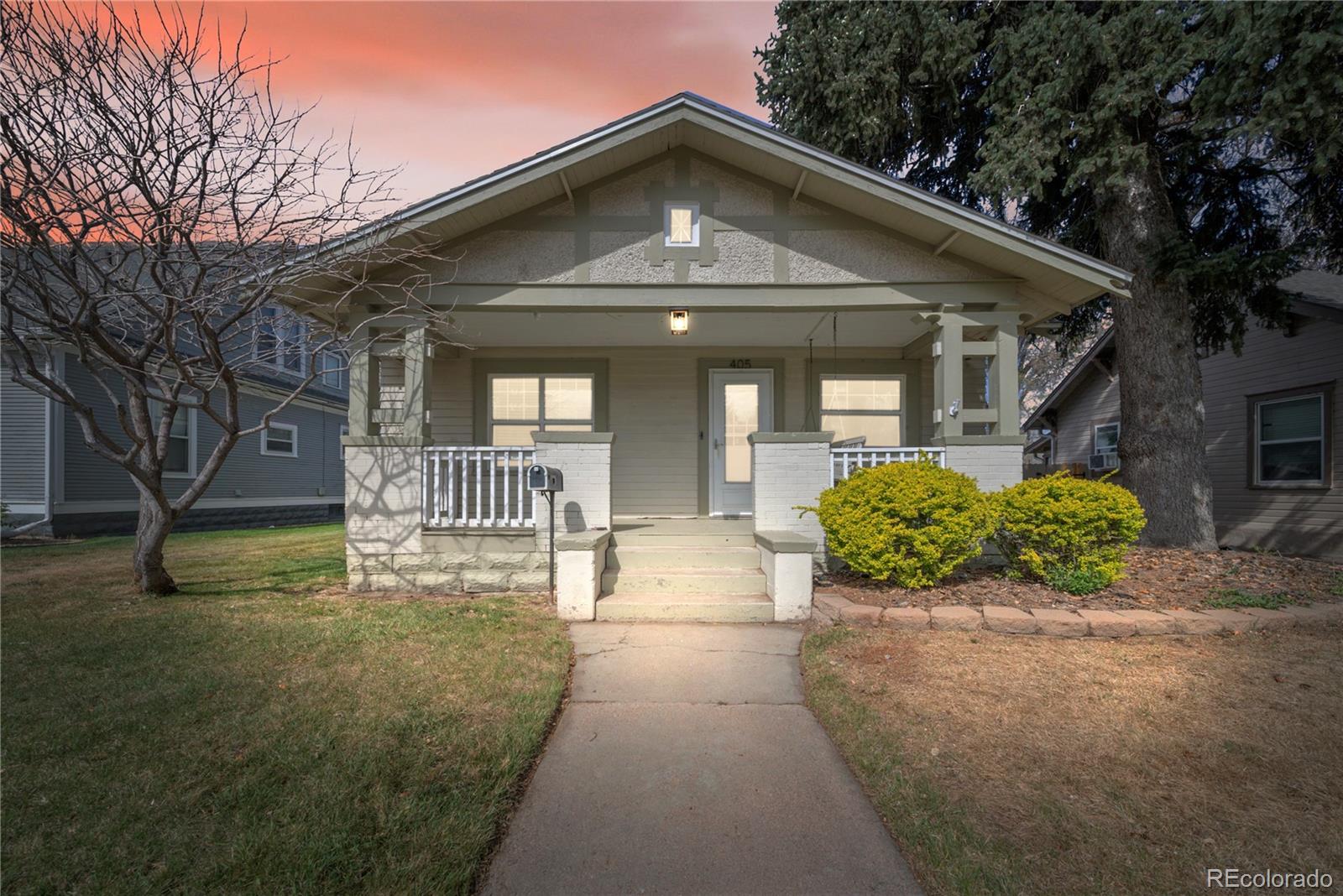 405 Maple Street Fort Morgan, CO 80701 - Photo 9 of 9 a front view of a house with a yard