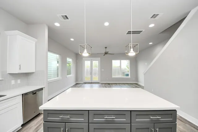 a view of a kitchen with a stove and a sink