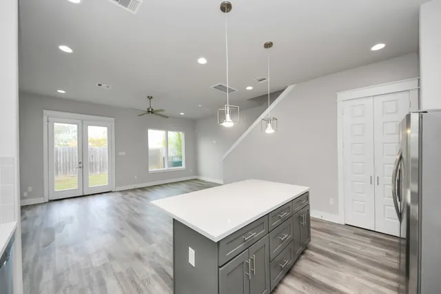 a bathroom with a sink a mirror and a shower