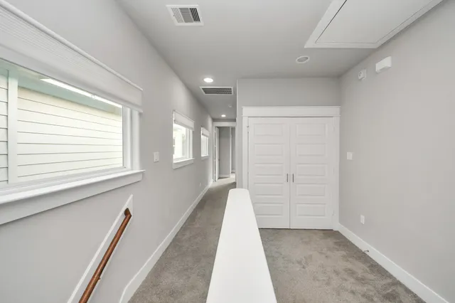 a view of a hallway with an entryway