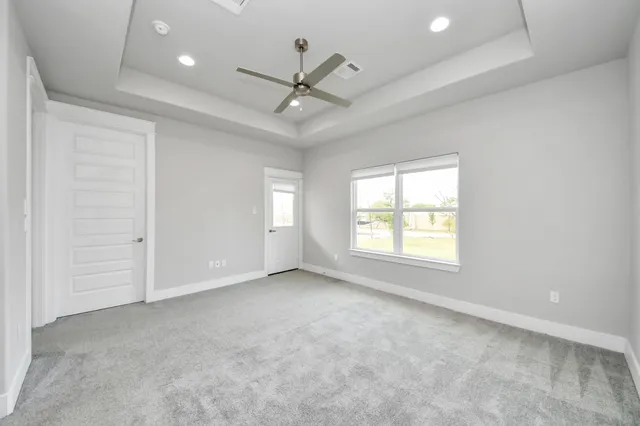 a view of an empty room with a window