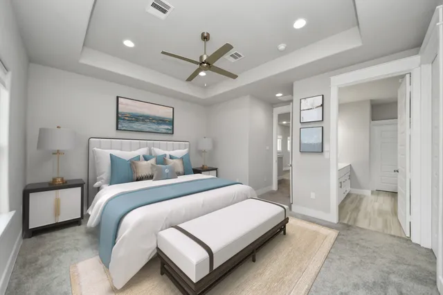 a bedroom with a bed and a chandelier