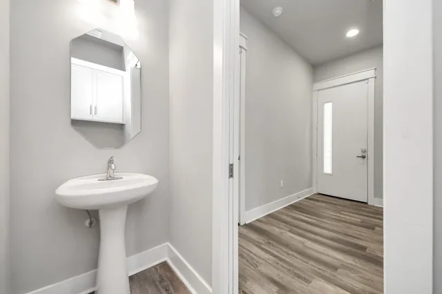 a bathroom with a sink and a mirror