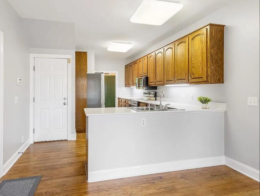 1525 Black Island Road Darien, GA 31305 - Photo 7 of 41 a view of kitchen with stainless steel appliances wooden floor and chair
