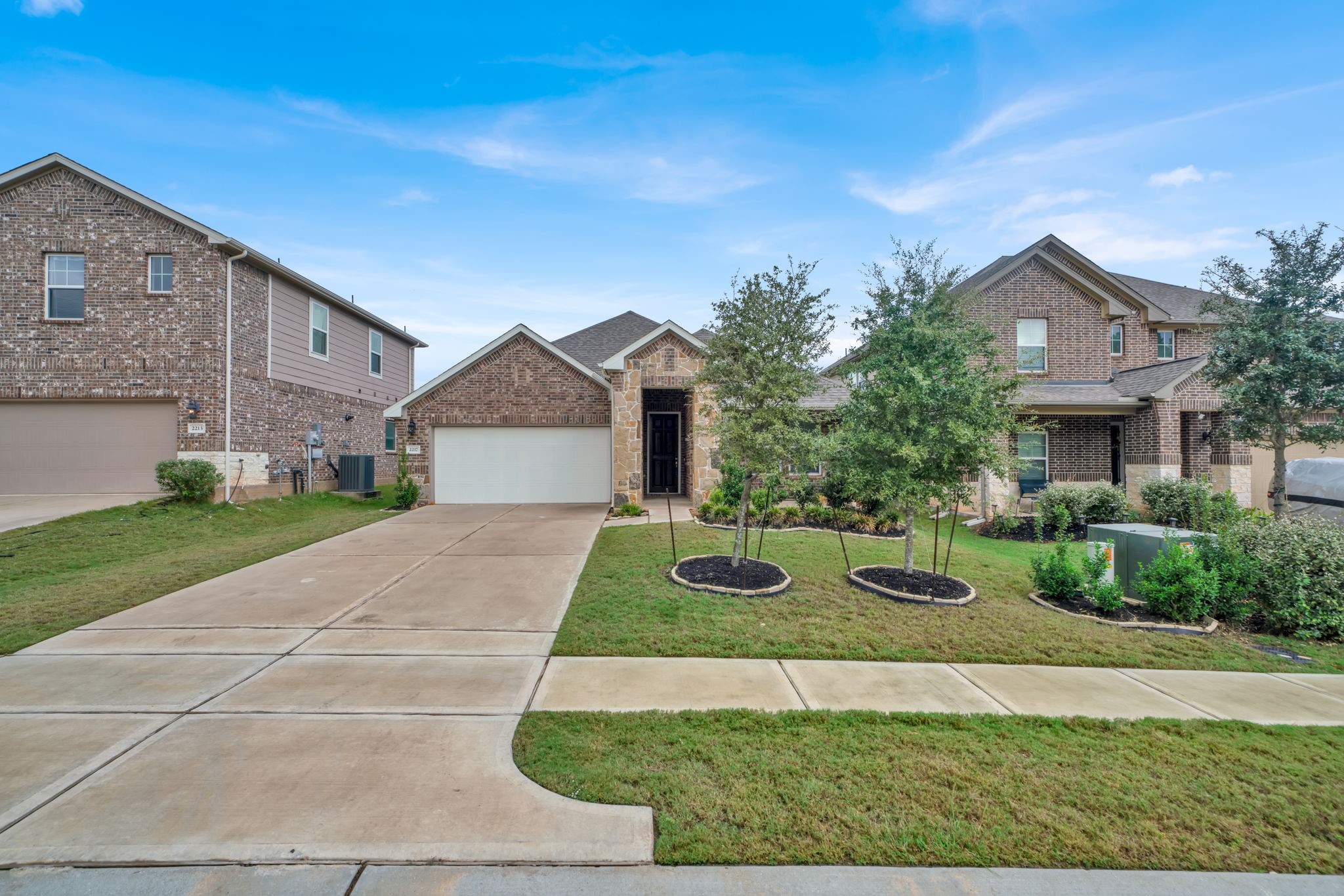 2217 Gadwall Court Conroe, TX 77384 - Photo 1 of 35 a front view of a house with yard and green space