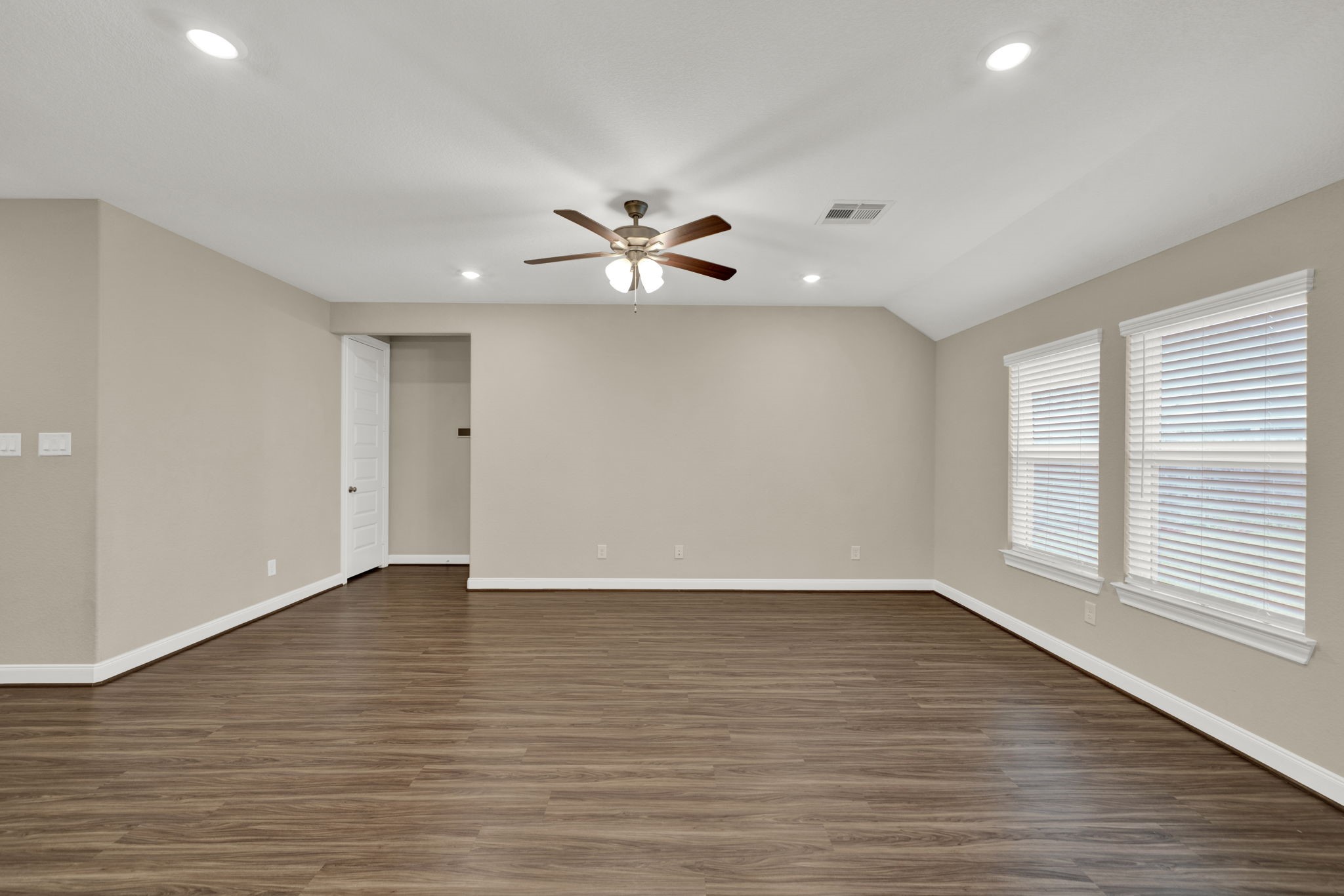2217 Gadwall Court Conroe, TX 77384 - Photo 11 of 35 wooden floor in an empty room with a window