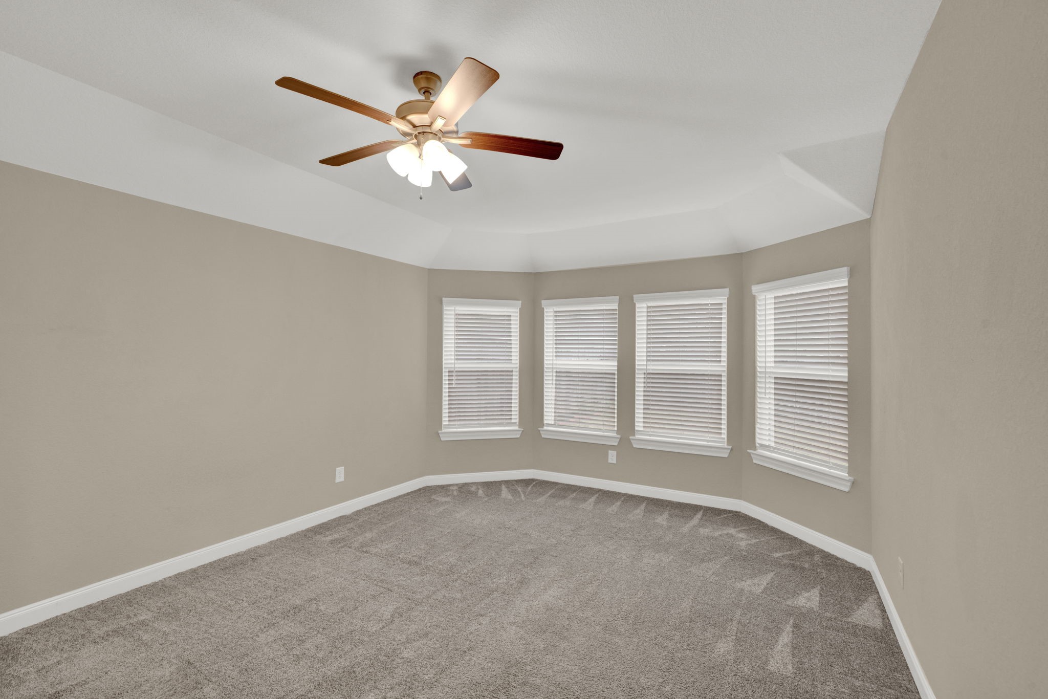2217 Gadwall Court Conroe, TX 77384 - Photo 14 of 35 an empty room with window and ceiling fan