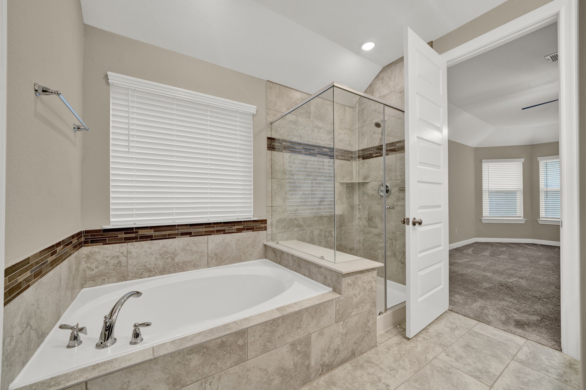 2217 Gadwall Court Conroe, TX 77384 - Photo 17 of 35 a bathroom with a bathtub and a shower