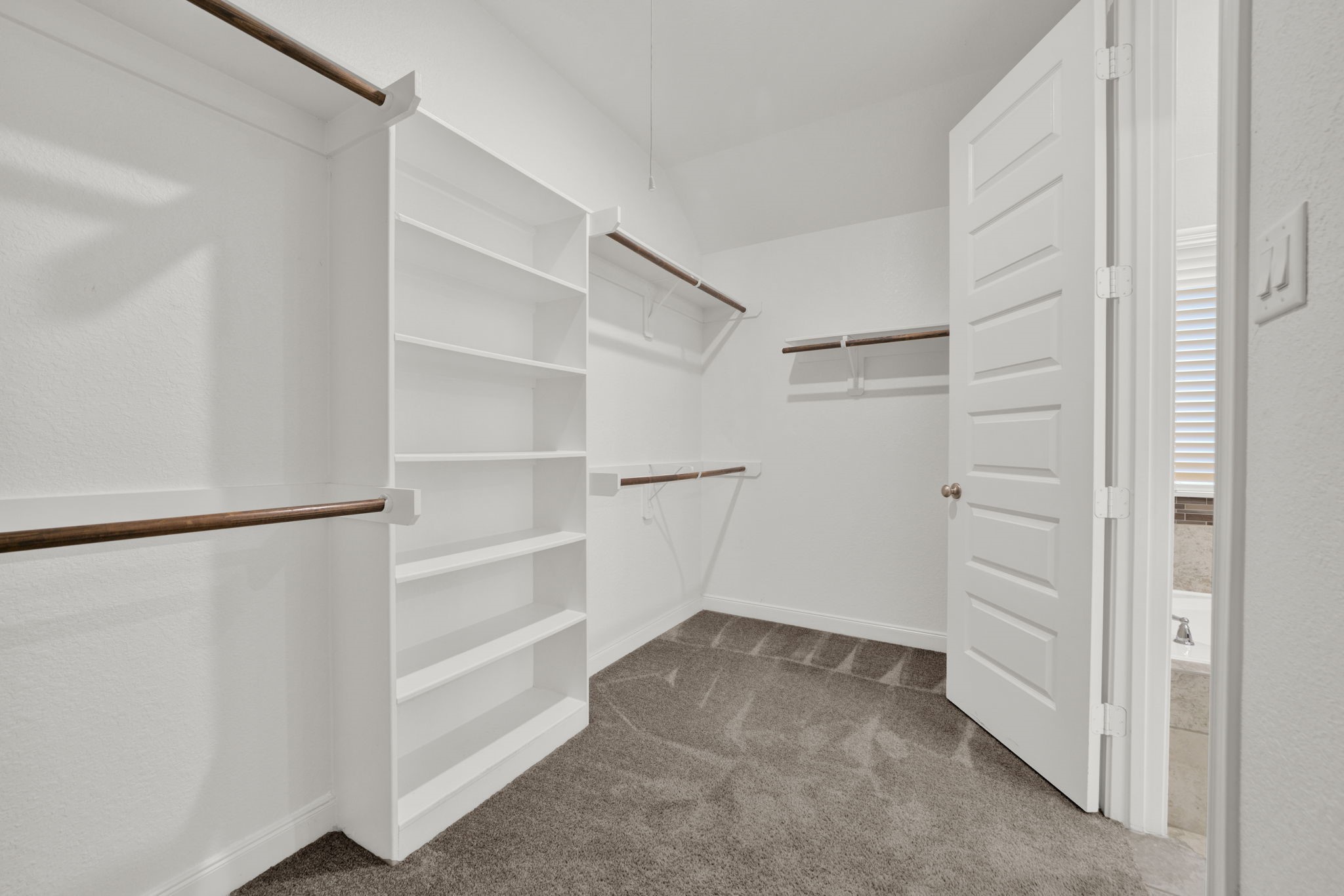 2217 Gadwall Court Conroe, TX 77384 - Photo 18 of 35 a view of an empty walk in closet