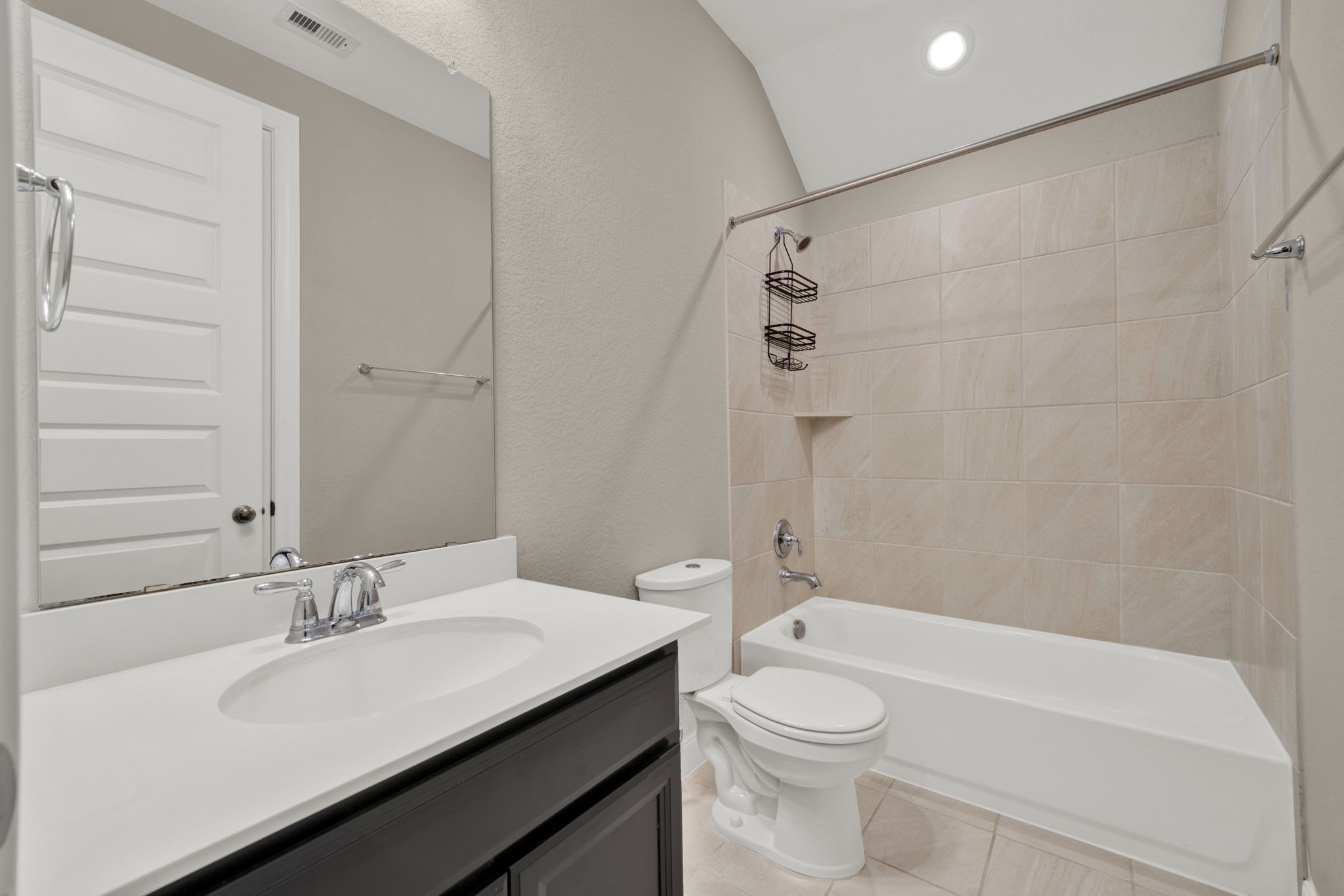 2217 Gadwall Court Conroe, TX 77384 - Photo 23 of 35 a bathroom with a sink a toilet and shower