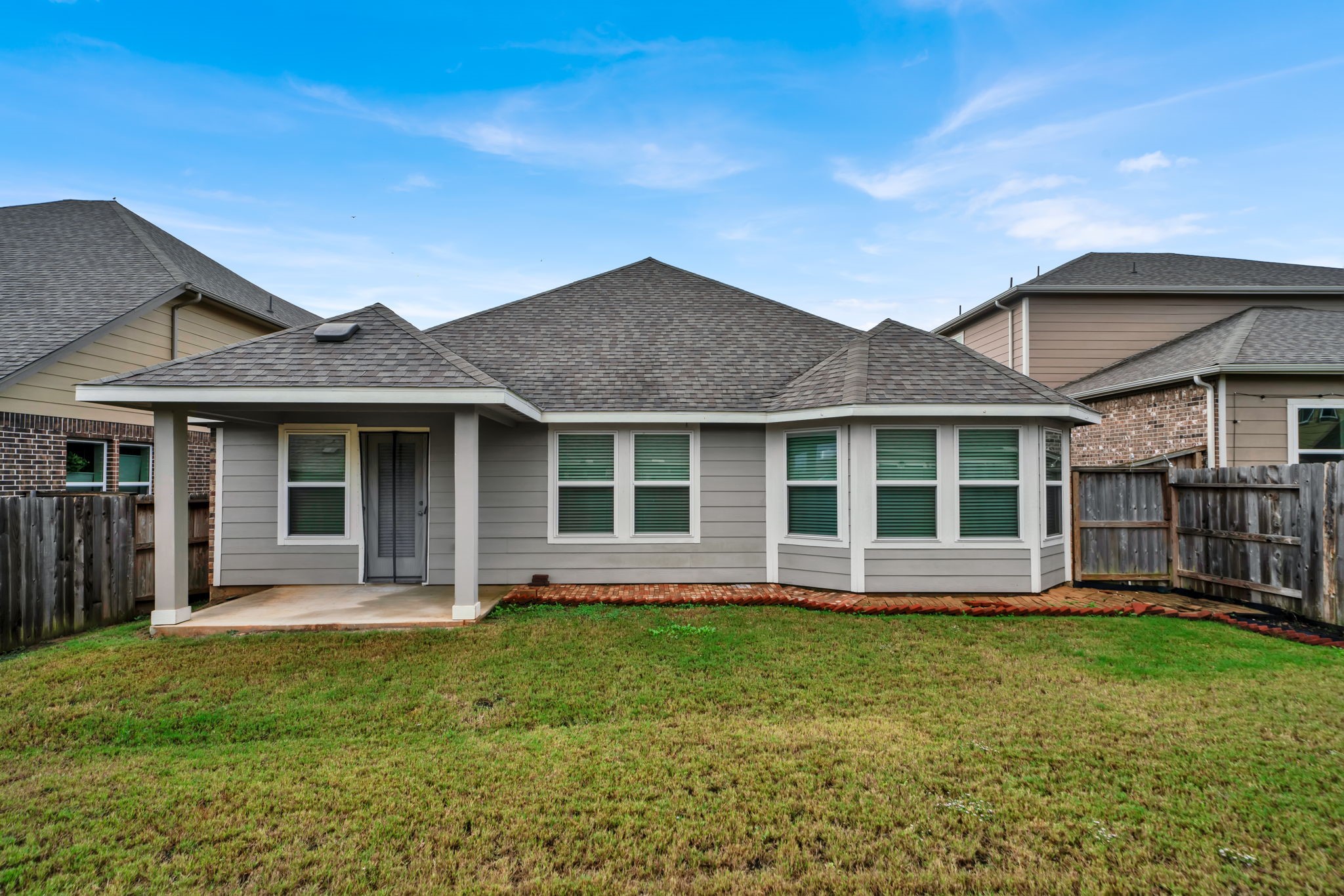 2217 Gadwall Court Conroe, TX 77384 - Photo 24 of 35 a front view of a house with garden